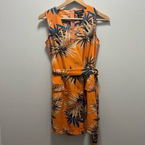 Papillon floral romper with faux pockets and buttons